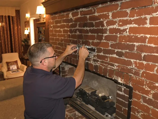 Lawndale Chimney Sweep expert fixing a fireplace in Lawndale, CA
